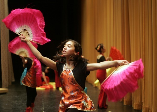 Kim Raff |The Salt Lake Tribune
Kaylin Weed practices backstage with other dancers for the welcoming prelude to the Utah Chinese New Year Celebration Program at Cottonwood High School in Murray, Utah on February 4, 2012.