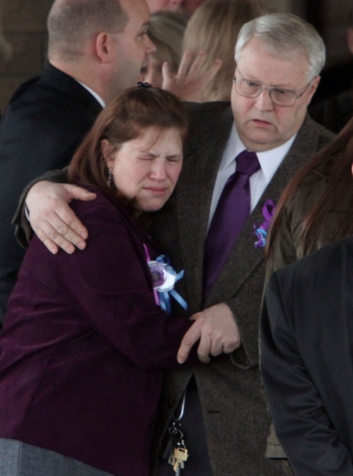 Rick Egan  | The Salt Lake Tribune 

Denise Cox hugs her father, Chuck Cox, after the funeral for Charlie and Braden Powell at the Life Center Church in Tacoma.