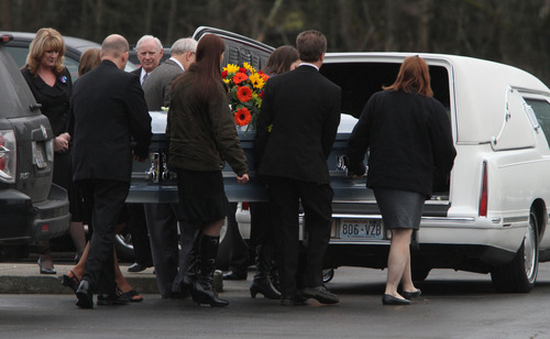Rick Egan  | The Salt Lake Tribune 
Chuck Cox and other family members and friends carry the casket after the services in Puyallup for Charlie and Braden Powell on Saturday.
