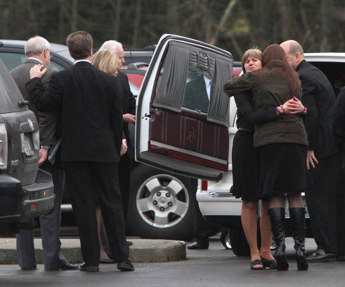 Rick Egan  |  The Salt Lake Tribune 
Family members and friends comfort each other after the services in Puyallup, Wash., for Charlie and Braden Powell on Saturday.