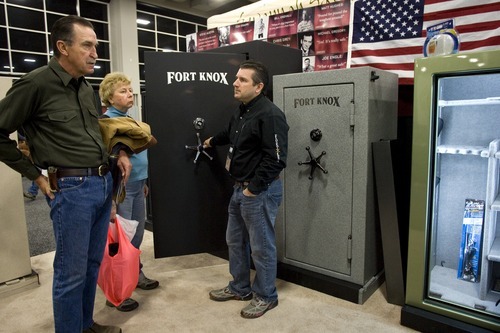 Vice President of Fort Knox, Bill James, speaks with customers at the Western Hunting and Conservation Expo on Sunday, February 12, 2012 at the Salt Palace in Salt Lake City. Fort Knox is a company who manufactures gun safes based in Orem.
ASHLEY FRANSCELL/Special to The Salt Lake Tribune