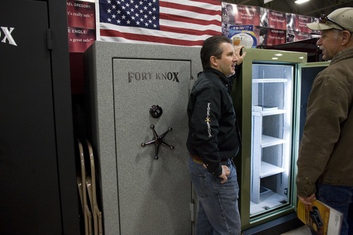 Vice President of Fort Knox, Bill James, speaks with a customer at the Western Hunting and Conservation Expo on Sunday, February 12, 2012 at the Salt Palace in Salt Lake City. Fort Knox is a company who manufactures gun safes based in Orem.
ASHLEY FRANSCELL/Special to The Salt Lake Tribune