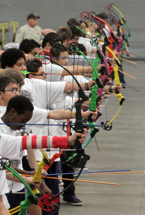 Francisco Kjolseth  |  The Salt Lake Tribune
A colorful line up of bows are pulled and sighted as the Utah State National Archery in the Schools Tournament takes place, run by the Utah Division of Wildlife, takes place at The Salt Palace Convention Center on Saturday as part of the Western Hunting and Conservation Expo.