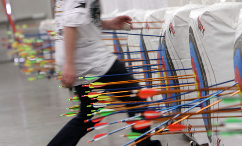 Francisco Kjolseth  |  The Salt Lake Tribune
A student gets ready to count up his target shots for the Utah State National Archery in the Schools Tournament, run by the Utah Division of Wildlife, that took place at The Salt Palace Convention Center on Saturday, February 11, 2012, as part of the Western Hunting and Conservation Expo.