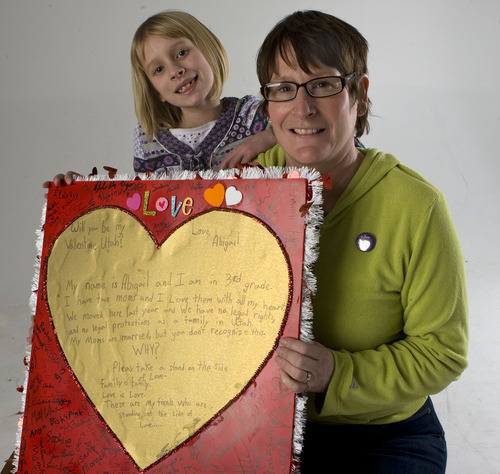 Al Hartmann  |  The Salt Lake Tribune
Abigail Hasting-Tharp and her mother Jamila Tharp hold Abigail's valentine to the state of Utah encouraging people to recognize her mothers' rights as a married couple.
