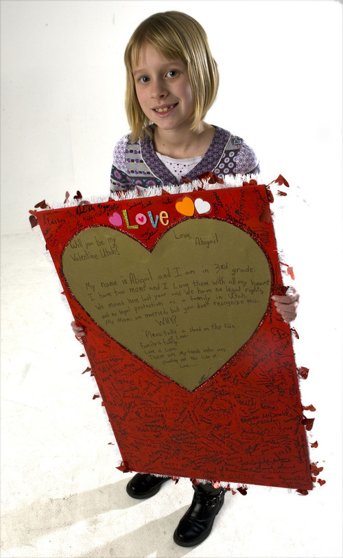 Al Hartmann  |  The Salt Lake Tribune
Abigail Hasting-Tharp holds her valentine to the state of Utah encouraging people to recognize her mothers' rights as a married couple.