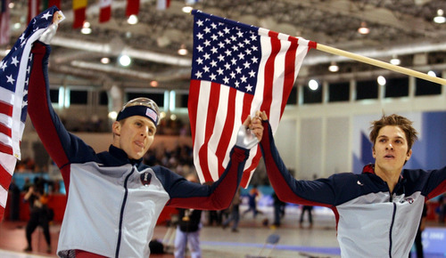 Danny La | Tribune file photo
Speedskaters Casey Fitzrandolph, left, and Kip Carpenter celebrate winning gold and bronze medals, respectively, for the United States in the men's 500 meters at the Utah Olympic Oval.