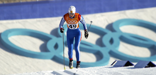 Al Hartmann | Tribune file photo
Russia's Olga Danilova skis past the huge Olympic rings during the 10K classical cross country race at Soldier Hollow, en route to a silver medal. Danilova was later expelled from the Olympics and stripped of her medals for doping.