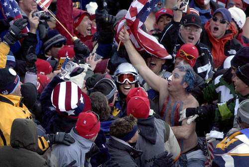 Paul Fraughton | Tribune file photo
American Jonny Moseley celebrates amid a crowd of fans after his first run at the men's freestyle moguls competition at Deer Valley Resort.