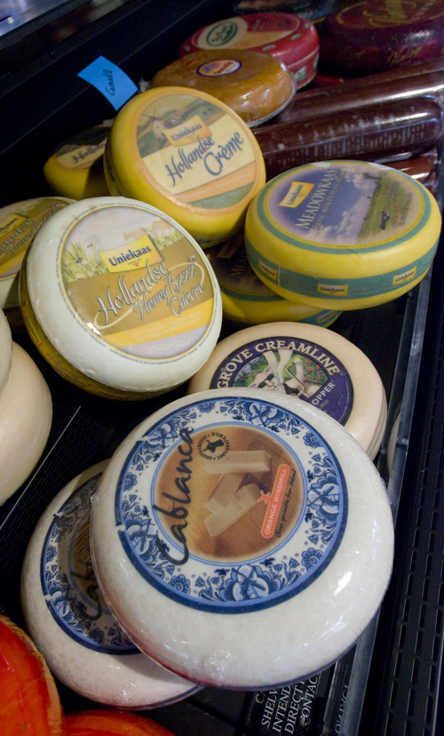 Al Hartmann  |  The Salt Lake Tribune
Wheels of artisan cheeses line the deli counter at the Harmons City Creek store, whose frozen food aisles will feature lights that dim when there are no shoppers in the vicinity, and brighten when someone walks by.