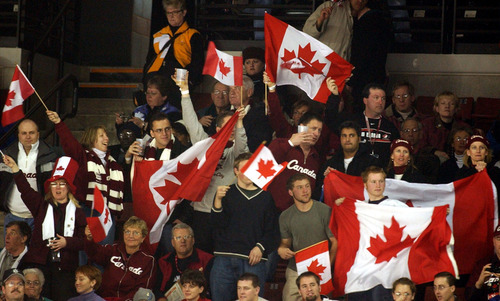 Danny La | Tribune file photo
Canadian fans cheer their women's hockey team as it beats Russia 7-0 in a preliminary-round game at the E Center in West Valley City.