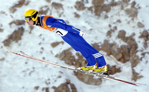 Leah Hogsten | Tribune file photo
Finland's Matti Hautamaeki soars through the air en route to a bronze medal in the men's large-hill ski jumping competition at the Utah Olympic Park.