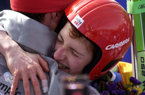Trent Nelson | Tribune file photo
Switzerland's Simon Ammann hugs his coach after winning his second gold medal of the Olympics in the men's large-hill ski jumping competition at the Utah Olympic Park.
