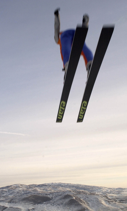 Steve Griffin | Tribune file photo
A ski jumper sails through the air and over the stunning Utah landscape during the finals of the men's large-hill competition at the Utah Olympic Park.