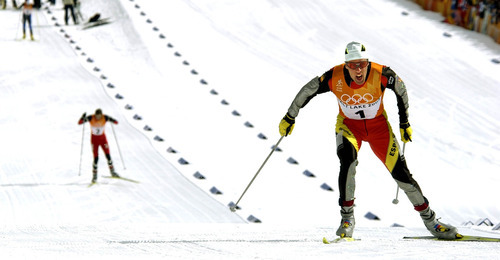 Paul Fraughton | Tribune file photo
Spain's Johann Muehlegg has a big lead on Norway's Frode Estil in the men's 10K free pursuit cross country race at Soldier Hollow. Muehlegg goes on to win the race for his second gold of the Olympics, but is later expelled for doping.