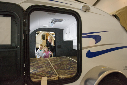 Paul Fraughton  |  The Salt Lake Tribune
Jenny Sperry and her children, Kaden, 4, and Lily, 3, peek inside a teardrop-style camp trailer, one of the smaller and less-expensive offerings at the Utah Sportsmen's Vacation and RV Show at the South Towne Expo Center in Sandy on Thursday.