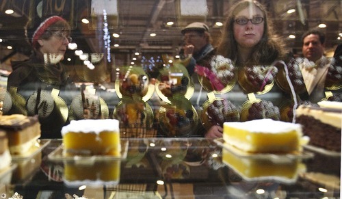 Leah Hogsten  |  The Salt Lake Tribune
Shoppers gaze at the pastry case in search of their favorite find. The new Harmons grocery opened Wednesday in downtown Salt Lake City. The store at 100 S. 135 East was built on two levels. A 50,000-square-foot ground level features a large produce department and meat counter with fresh fish. On the 18,000-square-foot mezzanine there is a deli with a seating capacity for about 300 customers.