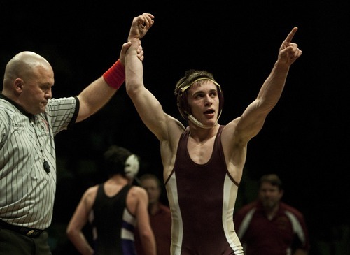 Chris Detrick  |  The Salt Lake Tribune
Maple Mountain's Britain Carter celebrates after defeating Box Elder's Shand Hardy in the 113lb weight class during the 4A wrestling tournament at Utah Valley University Thursday February 16, 2012.