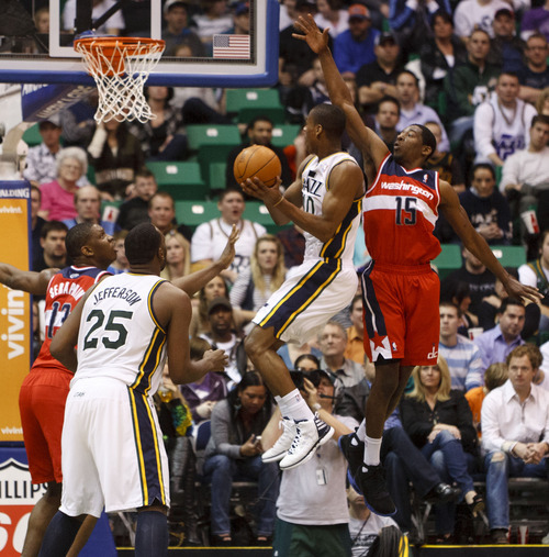 Trent Nelson  |  The Salt Lake Tribune
Utah Jazz guard Alec Burks (10) leaps to the basket in the second half, defended by Washington Wizards guard Jordan Crawford (15). Utah Jazz vs. Washington Wizards, NBA basketball at EnergySolutions Arena Friday, February 17, 2012 in Salt Lake City, Utah.