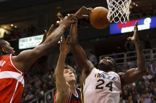 Trent Nelson  |  The Salt Lake Tribune
Utah Jazz forward Paul Millsap (24) reaches for the rebound, with Washington Wizards forward Kevin Seraphin (13) and Washington Wizards forward Jan Vesely (24). Utah Jazz vs. Washington Wizards, NBA basketball at EnergySolutions Arena Friday, February 17, 2012 in Salt Lake City, Utah.