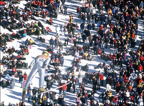 Grayson West | Tribune file photo
Fans watch from far below as Norway's Sverre Rotevatn soars over them during the ski jumping portion of the Nordic combined event at the Utah Olympic Park.