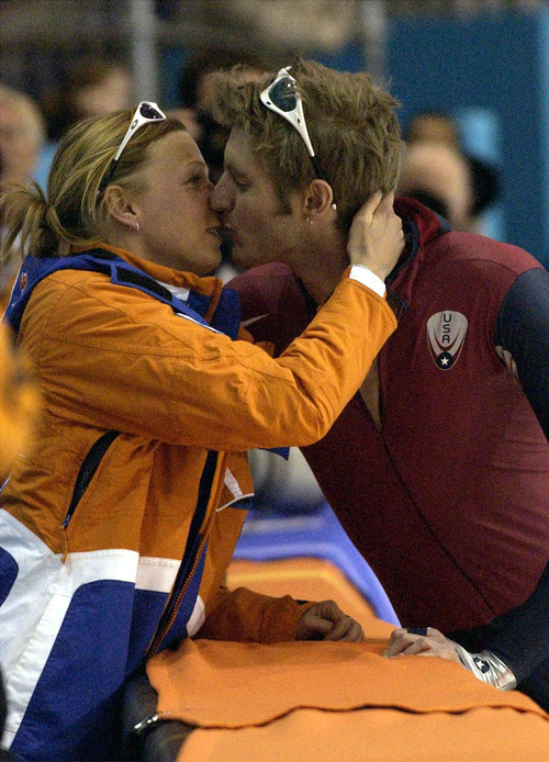 Leah Hogsten | Tribune file photo
Speedskater Annamarie Thomas of the Netherlands congratulates American Joey Cheek after Cheek won the bronze medal in the men's 1,000 meters at the Utah Olympic Oval.