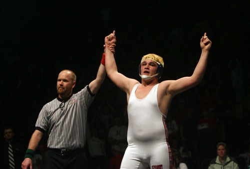 Kim Raff  |  The Salt Lake Tribune
Cassidy Smith of Altamont celebrates pinning Cameron Wilkerson of Duchesne in the 1A 285 lb match during the State Wrestling Tournament finals at Utah Valley University in Orem, Utah on February 18, 2012.