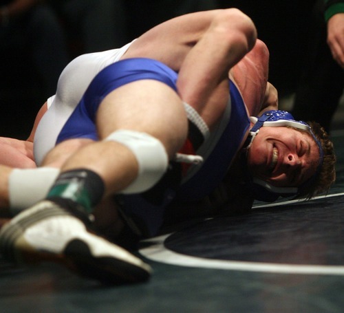 Kim Raff  |  The Salt Lake Tribune
(back) Kyle Foy of Altamont puts a hold on Preston Argyle of Rich during the 1A 170 lb match during the State Wrestling Tournament finals at Utah Valley University in Orem, Utah on February 18, 2012. Foy went on to win the match.