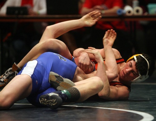 Kim Raff  |  The Salt Lake Tribune
(right) Cole Eldredge of Monticello puts a hold on Brandon Birch of Panguitch1A 132 lb match during the State Wrestling Tournament finals at Utah Valley University in Orem, Utah on February 18, 2012. Eldredge went on to win the match.