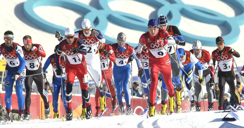 Al Hartmann | Tribune file photo
Skiers take off from the start of the mens cross country relay at Soldier Hollow.
