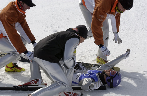 Trent Nelson | Tribune file photo
Teammates surround Germany's Martin Schmitt after his final jump, securing the men's large-hill ski jumping gold medal at the Utah Olympic Park.