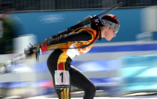 Al Hartmann | Tribune file photo
Germany's Andrea Henkel races past during the women's biathlon relay at Soldier Hollow, en route to her second gold medal of the Games. Henkel previously won the 15K individual race.
