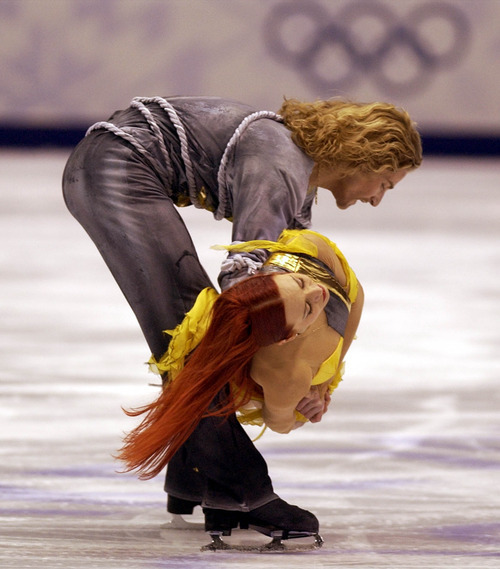 Steve Griffin | Tribune file photo
France's Marina Anissina and Gwendal Peizerat win the ice dancing gold medal, following their free dance at the Delta Center.