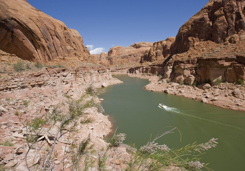 Al Hartmann  |  Tribune file photo
The proposed pipeline project would take water from Lake Powell in southeastern Utah and move it to populations centers in southwestern Utah. In this file photo, fishing boat heads up Sevenmile Canyon at Lake Powell.