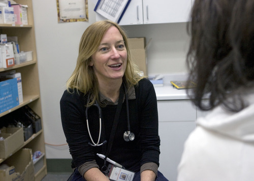 Al Hartmann  |  The Salt Lake Tribune
Fourth Street Clinic Medical Director Christina Gallop, talks to a patient during an exam Wednesday February 15. 