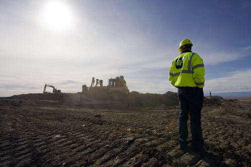 Al Hartmann  |  The Salt Lake Tribune
Kirk Treece, General Manager of ECDC Environmental, watches as earth-moving equipment moves soil around the massive landfill near East Carbon.   State regulators are poised to allow PCB waste to be buried in a small section at the landfill.