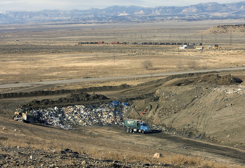 Al Hartmann  |  The Salt Lake Tribune
Garbage truck with municipal waste dumps its garbage in a tiny area the massive landfill near East Carbon.   ECDC Environmental wants to be permitted to bury PCB waste in a small section in of one of the super cells at the landfill.