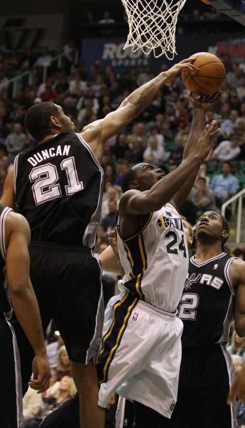 Rick Egan  | The Salt Lake Tribune 

San Antonio Spurs center Tim Duncan (21) blocks a shot by Paul Millsap (24) in NBA action in Salt Lake City, Monday, February 20, 2012.