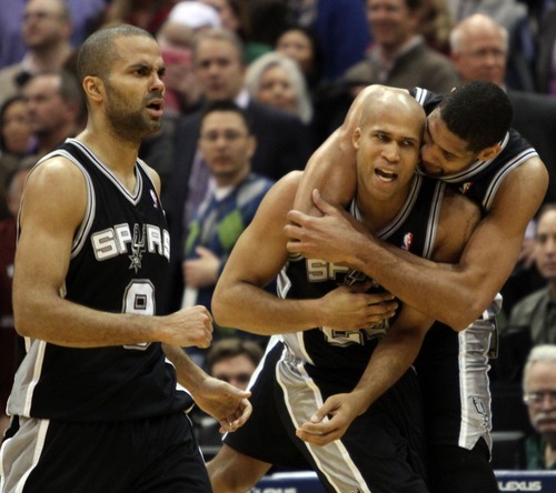 Rick Egan  | The Salt Lake Tribune 

San Antonio Spurs point guard Tony Parker (9), San Antonio Spurs small forward Richard Jefferson (24) and San Antonio Spurs center Tim Duncan (21) celebrate as Jefferson sunk a three-point shot, with just seconds left in the game, in NBA action in Salt Lake City, Monday, February 20, 2012.