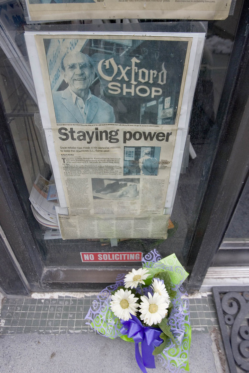 Paul Fraughton | The Salt Lake Tribune.
Flowers are left in front of the Oxford Shop in downtown Salt Lake city in honor of the store's owner Dick Wirick, who was killed this morning when he was struck by a bus.
 Tuesday, February 21, 2012