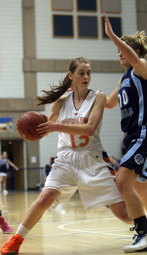 Kim Raff  |  The Salt Lake Tribune
Mountain Crest player Karlee Kartchner is defended by Salem Hills player Kiley Williams during the 4A girls Quarterfinals at Salt Lake Community College in Taylorsville , Utah on February 22, 2012. Mountain Crest went on to win the game 61-45.