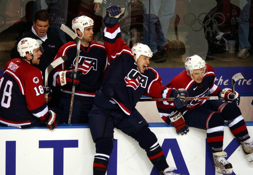 Danny La | Tribune file photo
Americans jump off the bench after beating Russia 3-2 in a men's hockey semifinal at the E Center in West Valley City, to earn a shot at rival Canada in the gold-medal game.