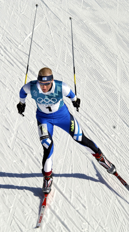 Al Hartmann | Tribune file photo
Finland's Samppa Lajunen wins his third gold medal of the Olympics by claiming the men's sprint race in Nordic combined at Soldier Hollow.