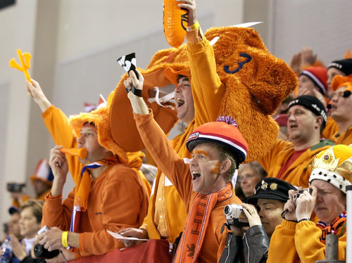 Steve Griffin | Tribune file photo
Orange-clad and boisterous Dutch fans celebrate gold and silver medals by Jochem Uytdehaage and Gianni Romme in the men's 10,000 meters at the Utah Olympic Oval.