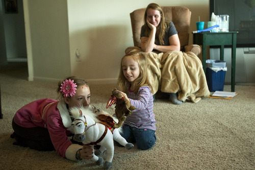 Chris Detrick  |  The Salt Lake Tribune
Marie Nuccitelli watches as her kids Eleanor, 9, and Sarai, 3, play at their home in Lehi Wednesday February 22, 2012.