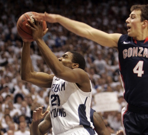 Kim Raff |The Salt Lake Tribune
BYU player Elias Harris goes for a basket as Gonzaga player Kevin Pangos defends during a game at the Marriott Center in Provo, Utah on February 2, 2012.