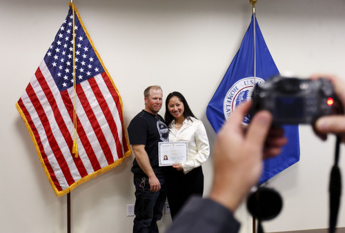 Trent Nelson  |  The Salt Lake Tribune
New U.S. citizen Lee-Ann Fieldsted, right, poses for a photo with her husband, Darrin Fieldsted, after a naturalization ceremony at the new Salt Lake City office of the U.S. Citizenship and Services District on Thursday, Feb. 23, 2012. USCIS held a grand opening celebration of its new Salt Lake office, and the naturalization ceremony where ten new citizens were naturalized.