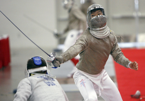 Francisco Kjolseth  |  The Salt Lake Tribune
John Hallsten, 17, of Sacramento, Calif. celebrates his win over Peter Pak, 16, of Long Island, N.Y., following a bout in the Junior Olympic Fencing competition at the Salt Palace Convention Center on Saturday, February 18, 2012.  Hundreds of young athletes are competing over the weekend in hopes of making the Junior National Team.