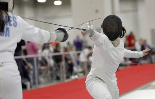 Francisco Kjolseth  |  The Salt Lake Tribune
Kierstyn Barnes, 16, left, of Dallas, and Taylor Yang, 18, of Los Angeles,compete in a bout during the Junior Olympic Fencing competition.