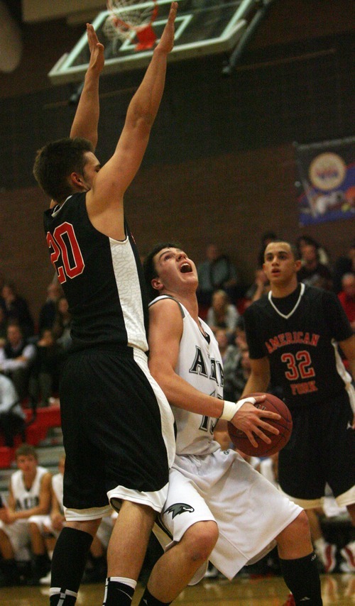 Kim Raff I The Salt Lake Tribune
(left) American Fork player Danny Beddes blocks Alta player Tanner Jones during a game at Alta High School in East Sandy, Utah on December 14, 2011.  American Fork went on to win the game 57-50.